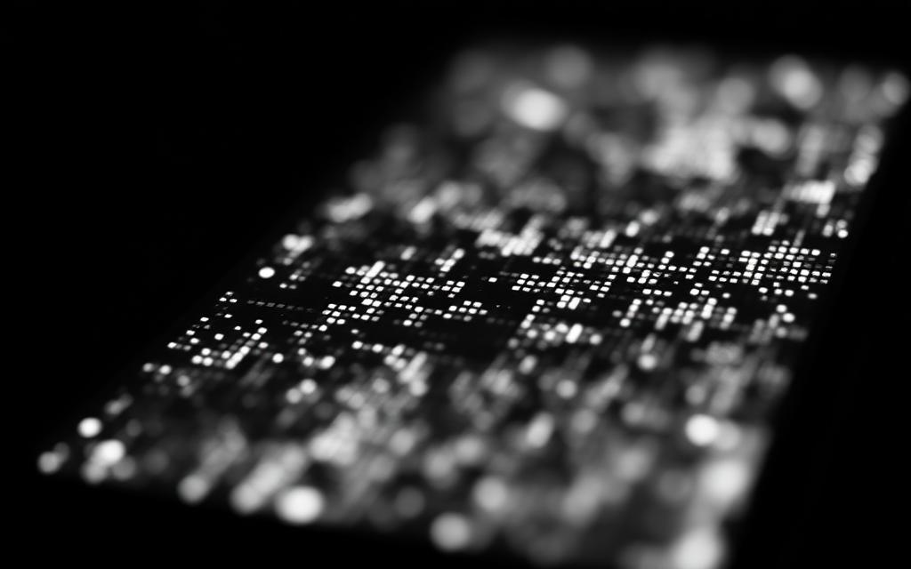 Macro shot of glowing distorted phone pixels in the dark